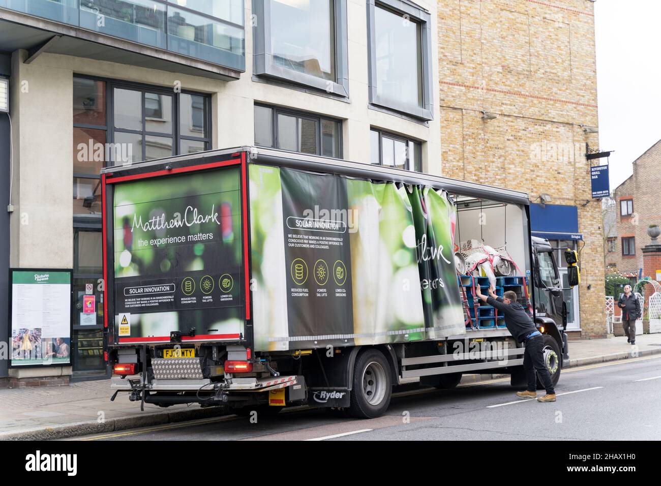 delivery men arrange the beer barrels at Matthew Clark delivery truck