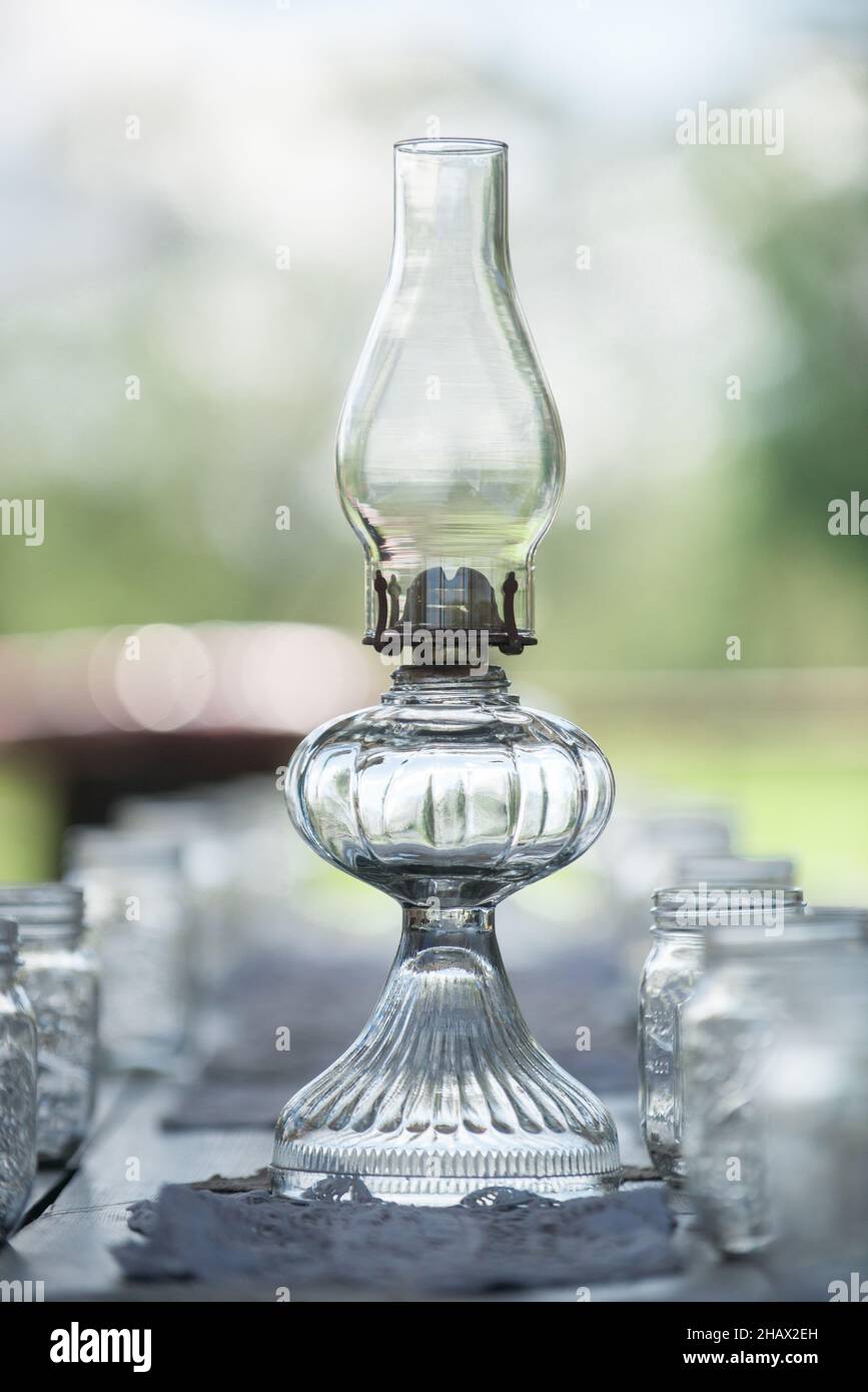 Glass lantern centerpiece surrounded bymason jars Stock Photo Alamy