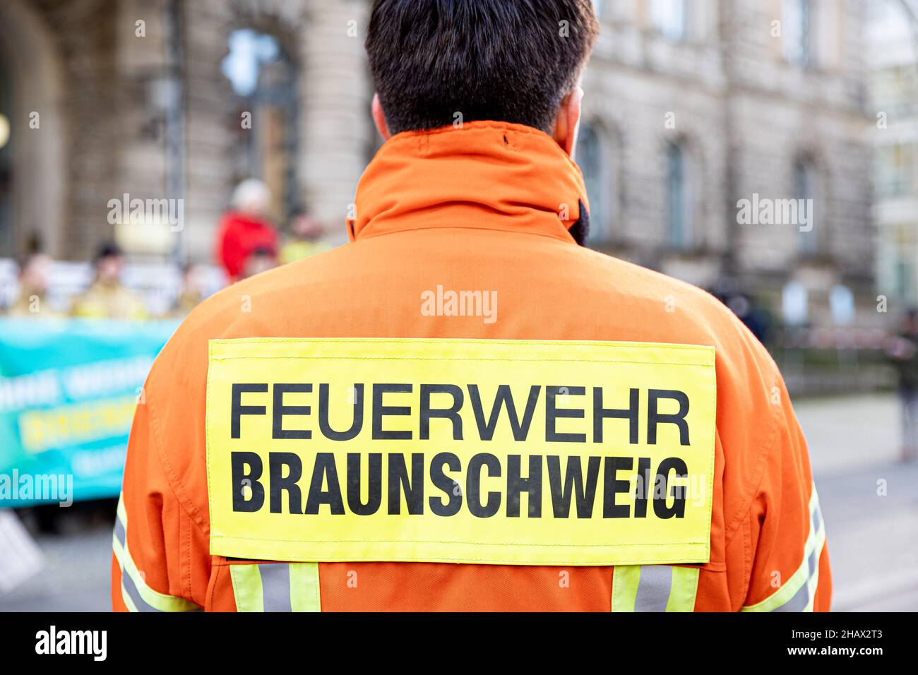 Hanover, Germany. 10th Dec, 2021. The lettering 'Braunschweig Fire Department' can be read on a firefighter's turnout gear during a demonstration. Credit: Moritz Frankenberg/dpa/Alamy Live News Stock Photo