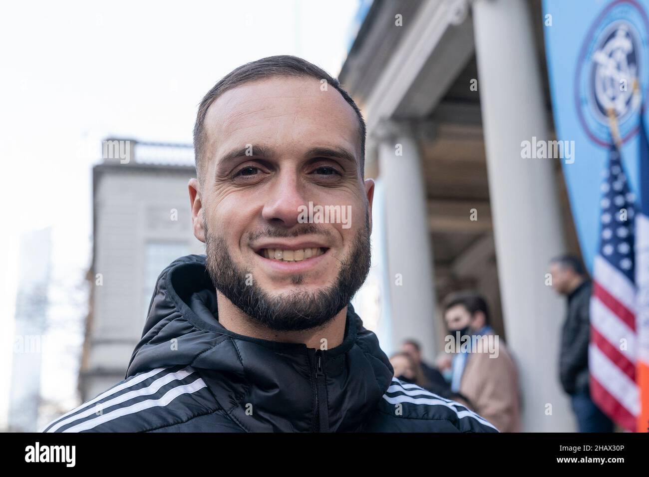 New York, New York, USA. 14th Dec, 2021. Defender Maxime Chanot poses during celebration for NYCFC winning the 2021 MLS Cup on City Hall steps. NYCFC finished the regular season in 4th place and played almost all playoff games away. Winning the MLS Cup is the first trophy won by the franchise since it was established 7 years ago. NYCFC is part of the City Football Group which owns football clubs around the world. Sean Johnson was named MVP of the playofffs. (Credit Image: © Lev Radin/Pacific Press via ZUMA Press Wire) Stock Photo