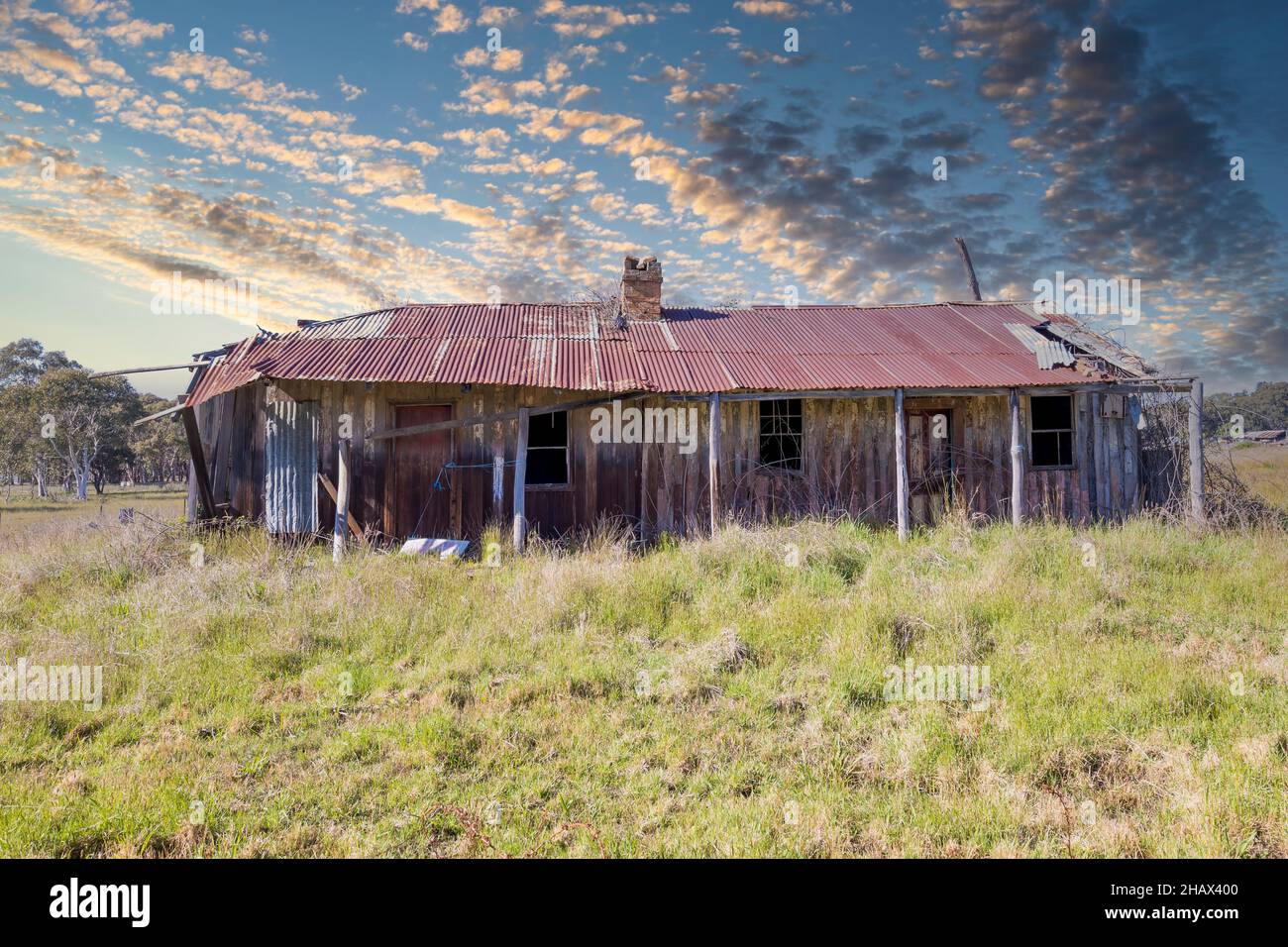 Photograph of an old and rusted out and broken down wooden residential ...