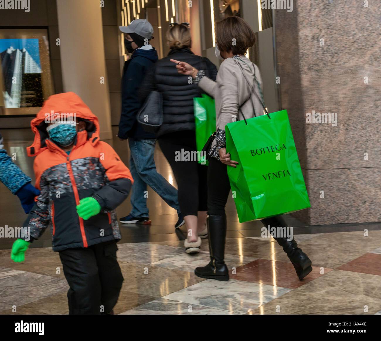 Shoppers with Bottega Veneta shopping bags in Brookfield Place in Lower Manhattan in New York on Sunday, December 5, 2021.  (© Richard B. Levine) Stock Photo