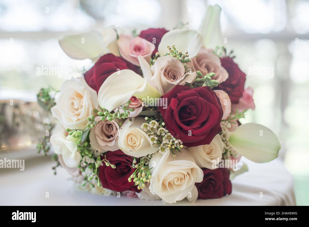 Red, pink and white floral brides bouquet Stock Photo