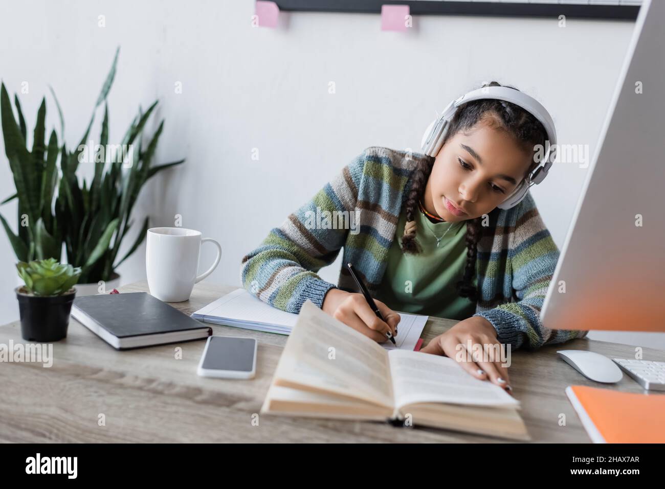 African teen girl studying book hi-res stock photography and images - Alamy