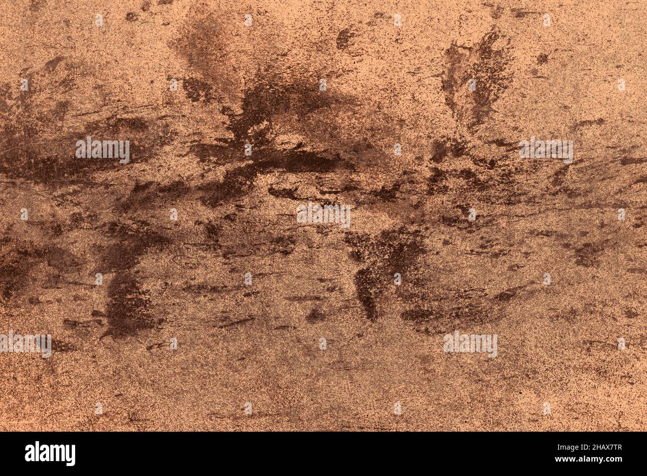 Scattered black spots on brown concrete wall with grunge texture for background Stock Photo