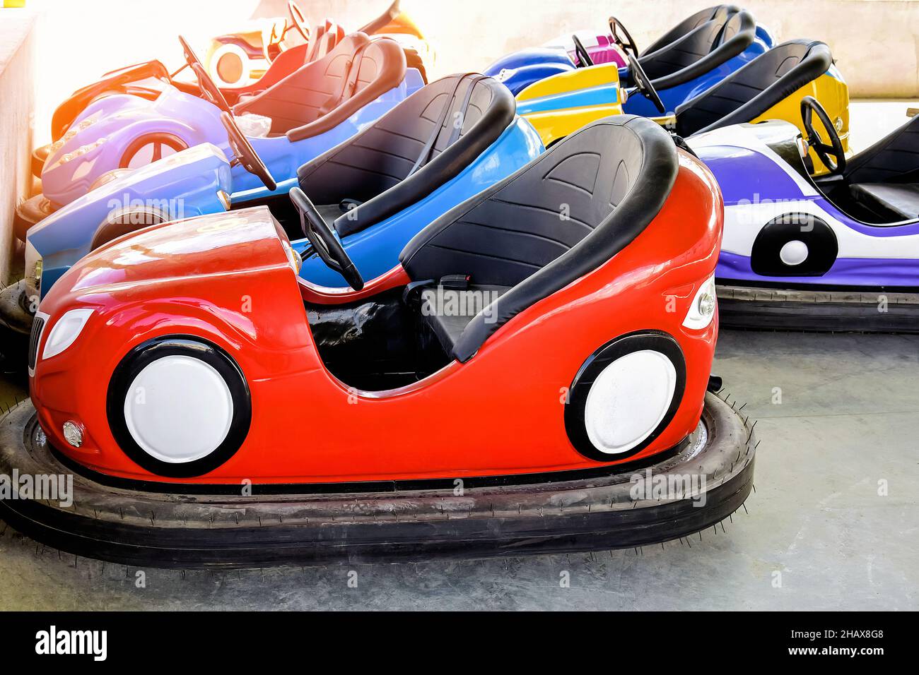 Children's attractions. Rows of Bump Cars. Colorful electric car for
