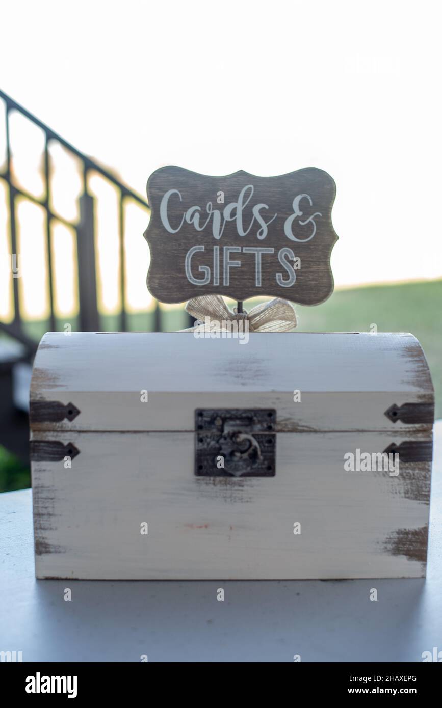 White vintage card gift box with cards and gifts sign on tiop Stock Photo