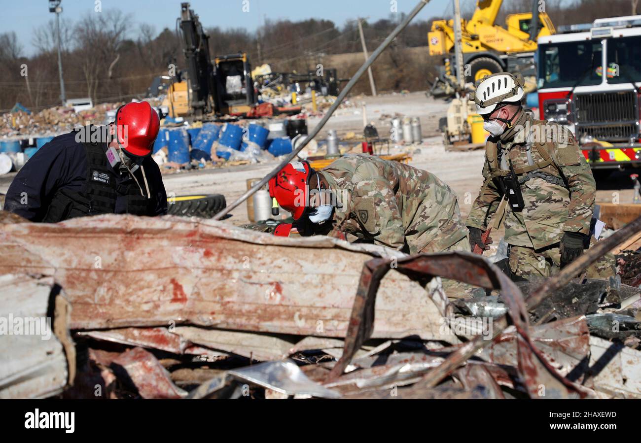 Mayfield, United States Of America. 13th Dec, 2021. Mayfield, United States of America. 13 December, 2021. U.S. Army National Guardsmen assist in clearing debris in the aftermath of devastating tornadoes that swept across four states destroying buildings and killing dozens December 13, 2021 in Mayfield, Kentucky. Credit: S1C Benjamin Crane/U.S. Army/Alamy Live News Stock Photo
