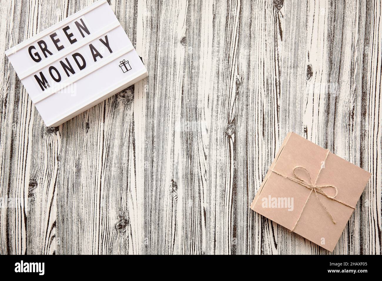 Lightbox with Green Monday text, craft gift box. Concept of online shopping. Top view Stock