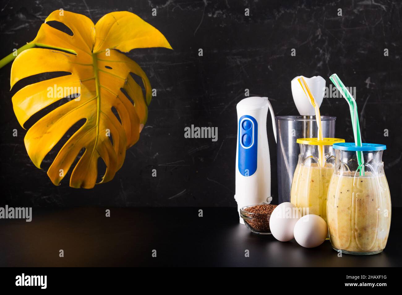 Electric blender and cocktails. Chicken eggs and cocktails in glasses