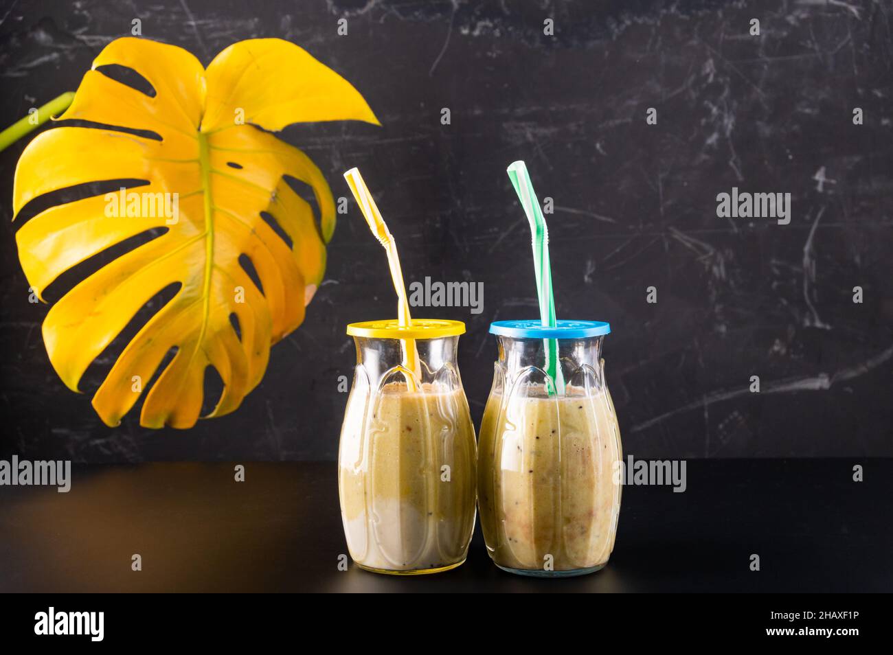 Two glasses with a cocktail. Two glasses with straws. Glasses of smoothies. Stock Photo