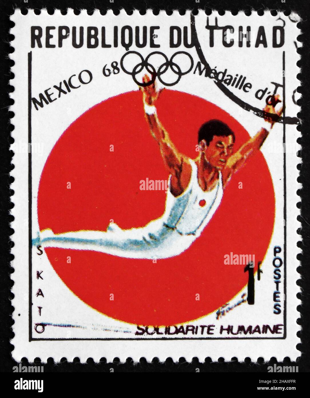 CHAD - CIRCA 1969: a stamp printed in Chad shows Sawao Kato, All Around Gymnastics, Winner of 1968 Olympic Games, Mexico, circa 1969 Stock Photo