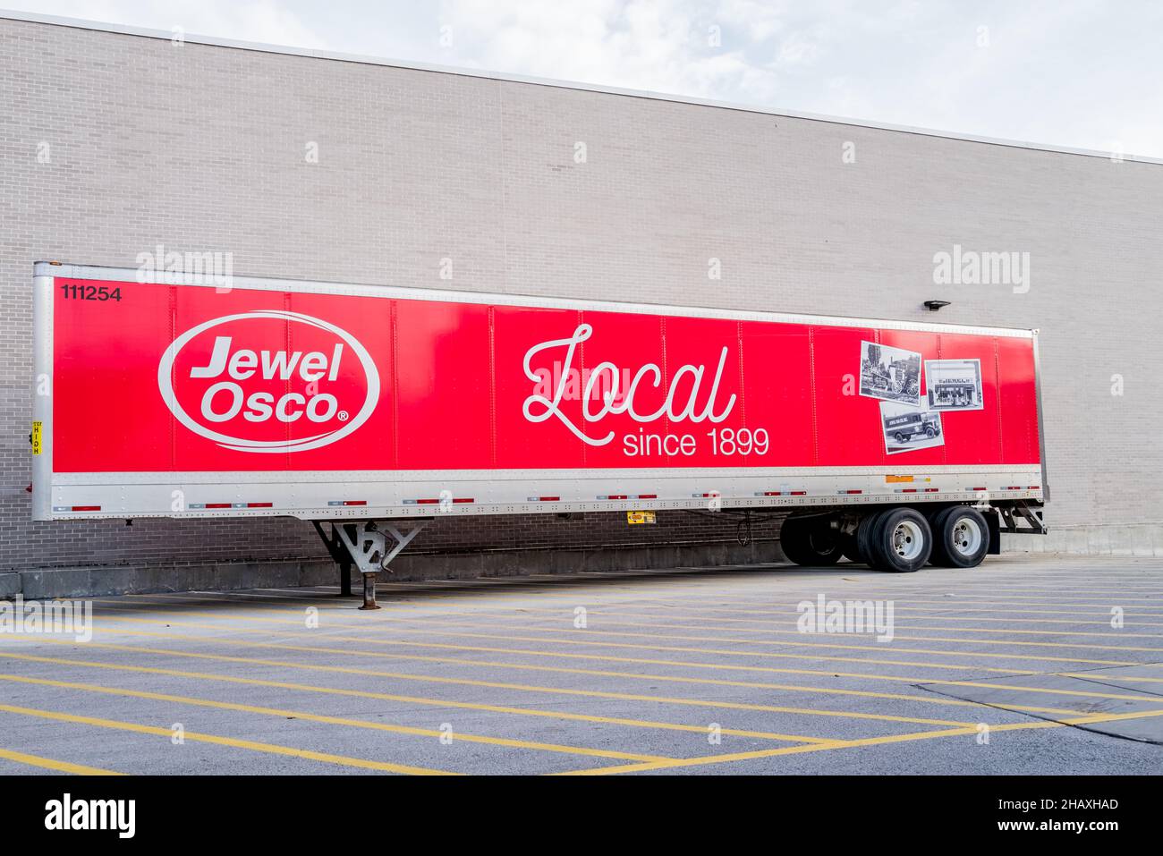 JewelOsco flatbed trailer parked behind grocery store in loading area