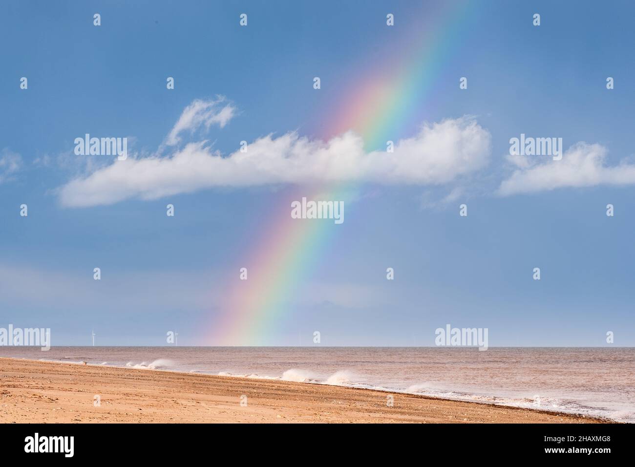 Rainbow over the sea with beach and white cloud Stock Photo - Alamy