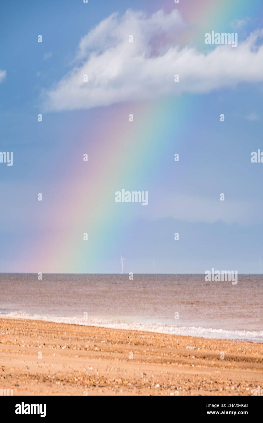 Rainbow over the sea with beach and white cloud Stock Photo - Alamy