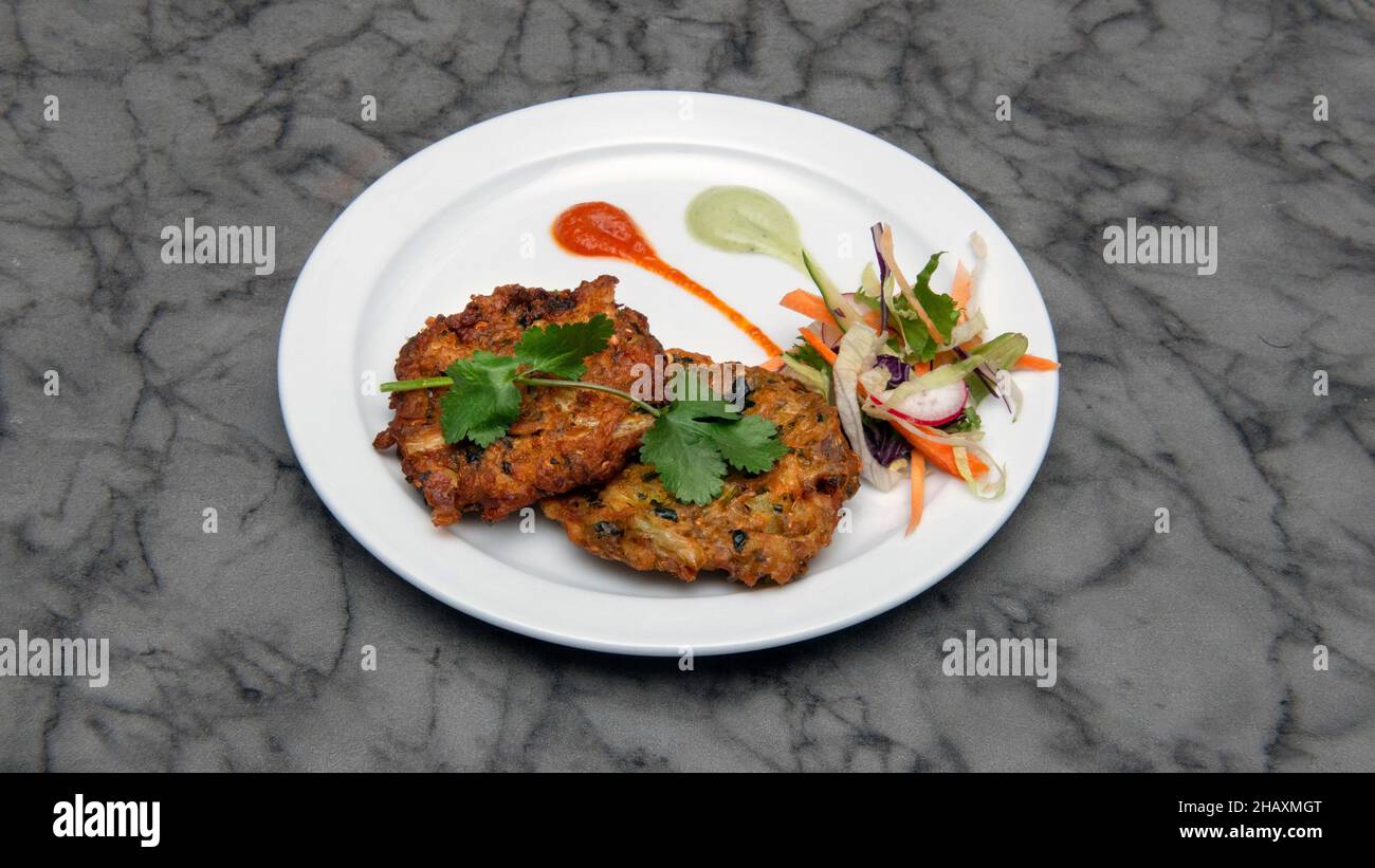 Onion spinach bhaji Indian food Stock Photo - Alamy