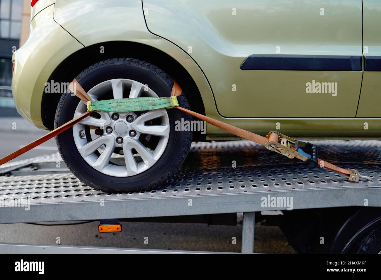 Car wheel belt fixing tow truck mechanism Stock Photo