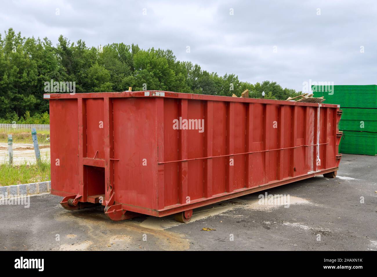Recycling garbage waste management container with construction material in the new building