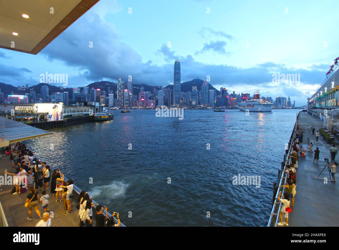 View of the Hong Kong island skyline in the evening with Ocean Terminal ...