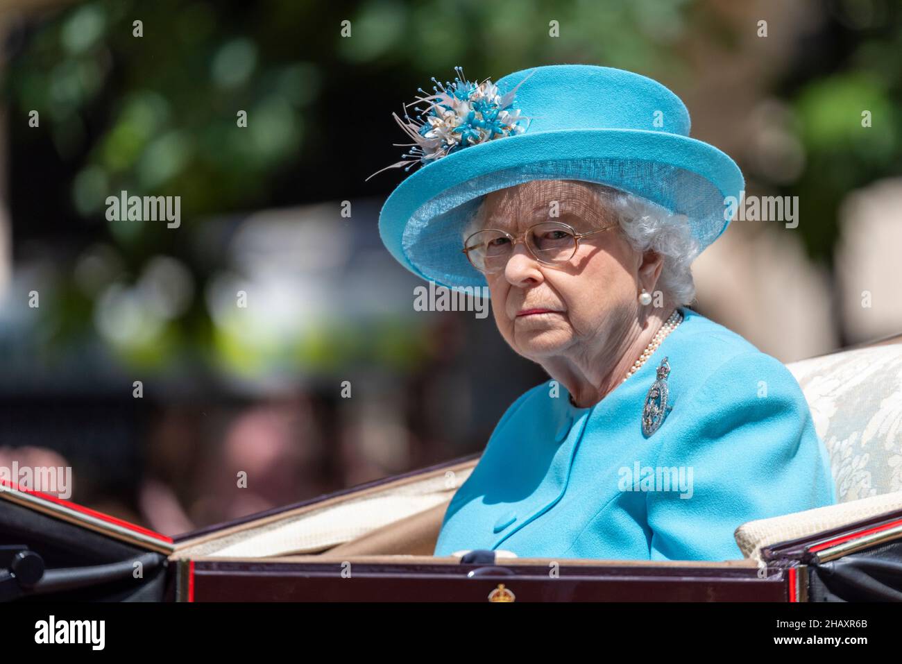 Queen Elizabeth II at Trooping the Colour 2018 in blue Angela Kelly design outfit. Alone in carriage with unhappy appearance Stock Photo