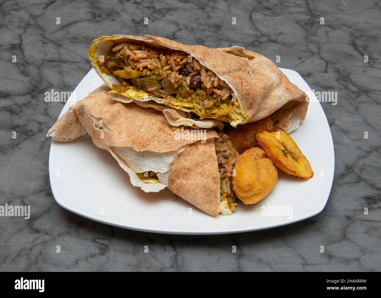 Curried goat wrap Jamaican & West Indian Food Stock Photo