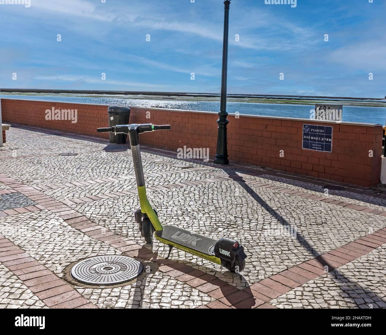 A Link Electric Scooter for hire in the port of Faro, Portugal. Stock Photo
