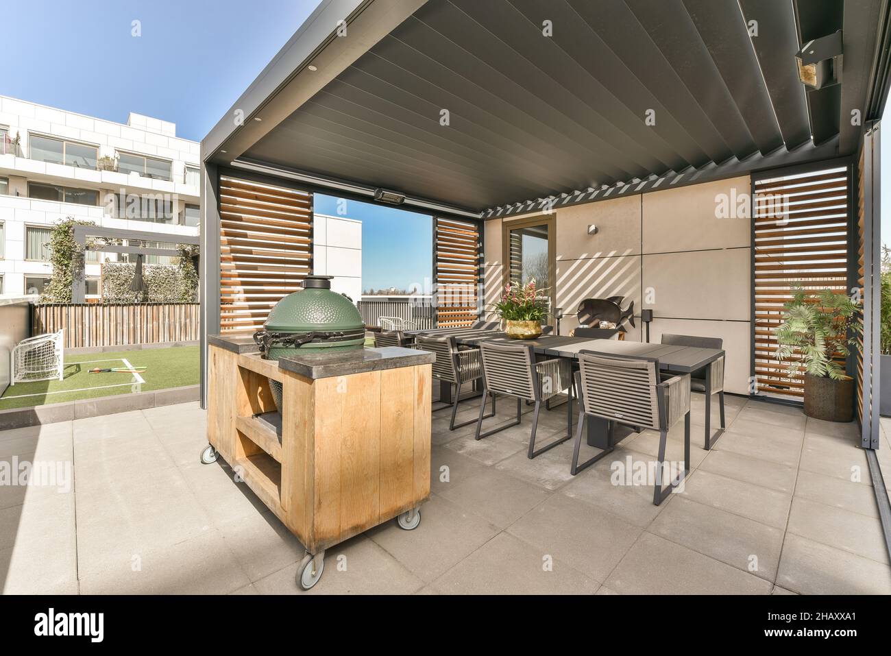 Exterior of spacious modern terrace with dining table with chairs