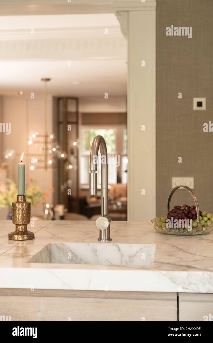 Marble kitchen counter with built in sink with chrome tap plate with