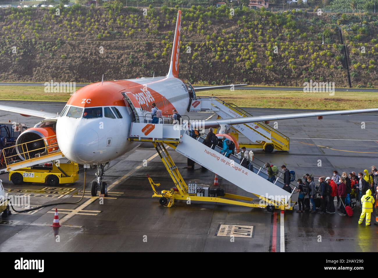 Passengers boarding easyJet plane in Christiano Ronaldo Airport, Madeira, Portugal Stock Photo