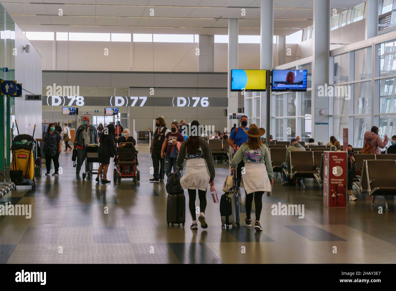 Calgary, Canada - 2 October 2021: Passengers waiting for their flights inside Calgary International Airport Stock Photo