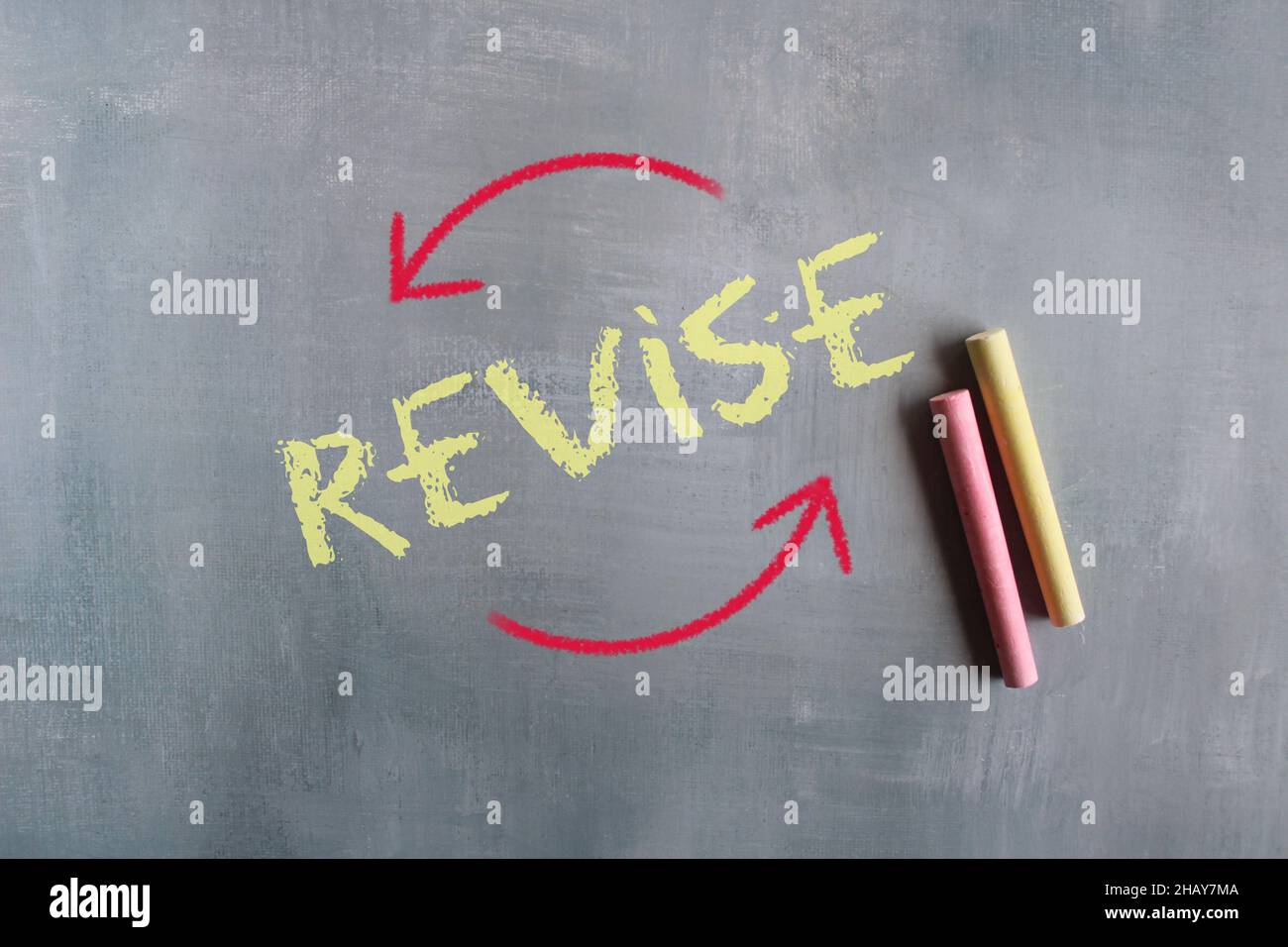 Chalkboard drawing image of arrow and text REVISE Stock Photo