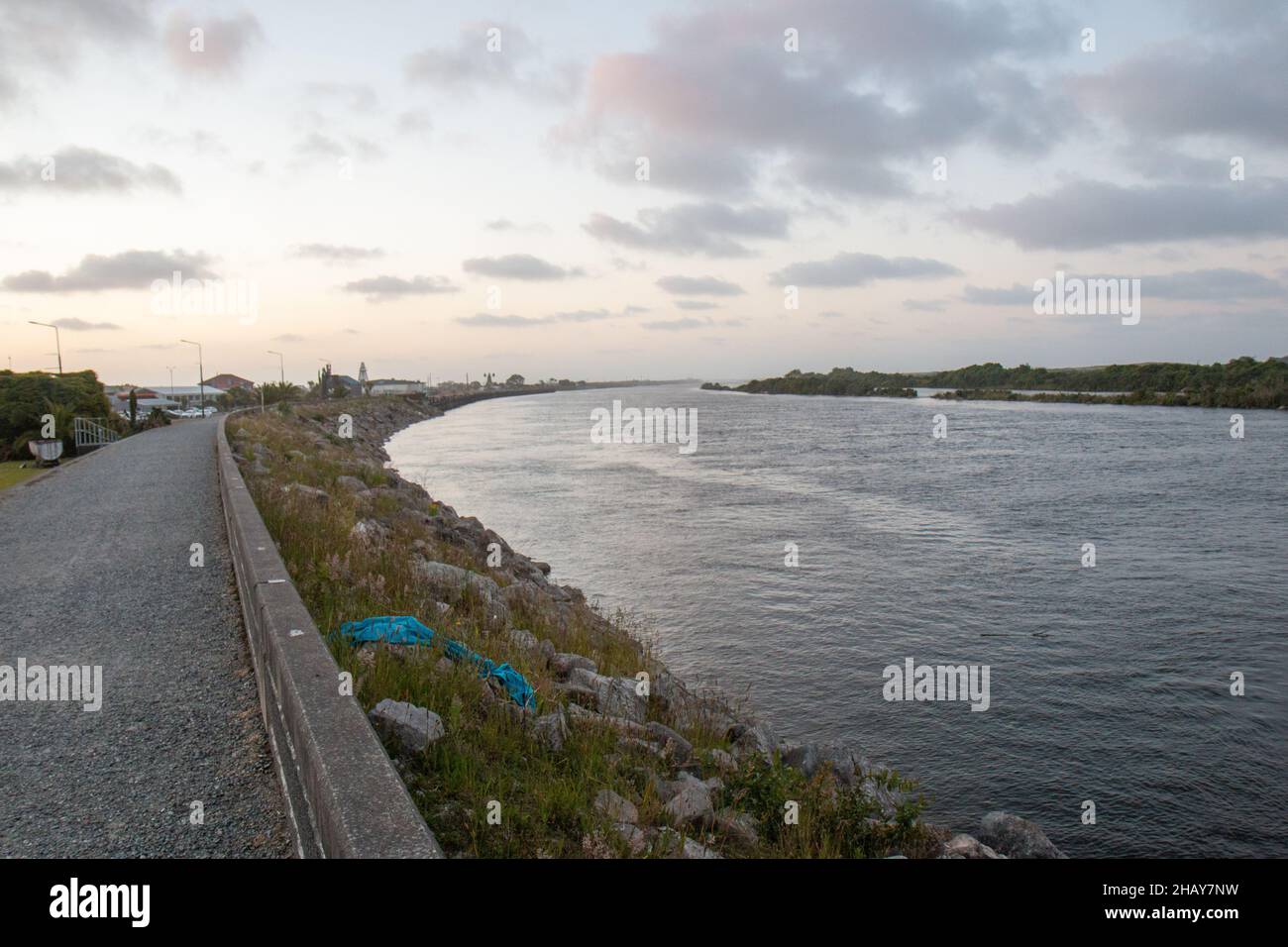 The banks of the Grey River at dusk, Greymouth, South Island, New Zealand Stock Photo