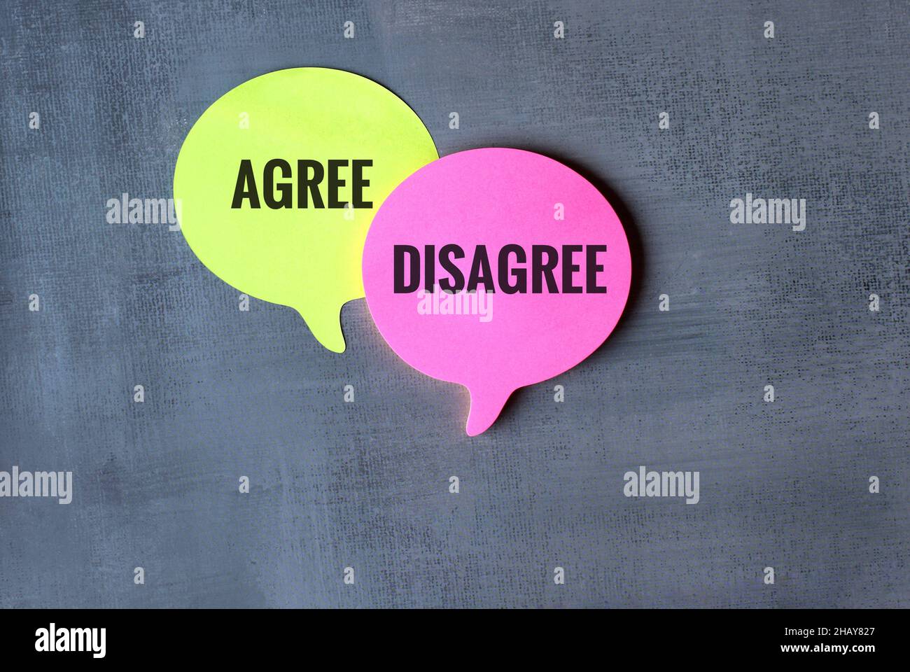 Opinion, argument and discussion concept. Speech bubble with text AGREE and DISAGREE Stock Photo
