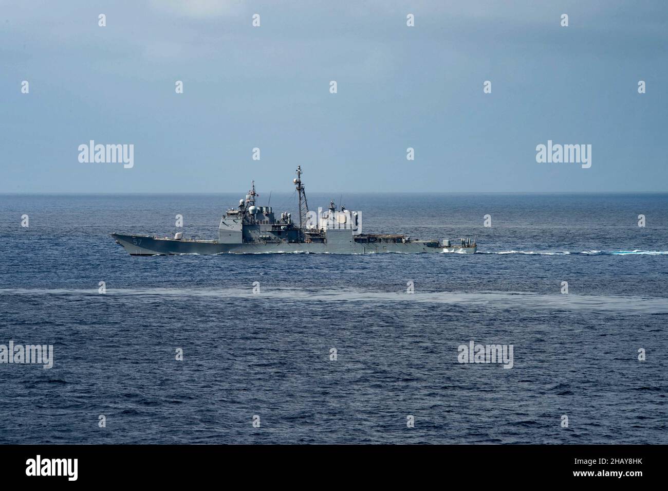 211214-N-PV401-1012 INDIAN OCEAN (Dec. 14, 2021) Ticonderoga-class guided-missile cruiser USS Lake Champlain (CG 57) transits alongside Nimitz-class aircraft carrier USS Carl Vinson (CVN 70), Dec. 14, 2021. Carl Vinson Carrier Strike Group and elements of the Royal Australian Navy are conducting a bilateral training exercise to test and refine warfighting capabilities in support of a free and open Indo-Pacific.  (U.S. Navy photo by Mass Communication Specialist Seaman Elizabeth Grubbs) Stock Photo