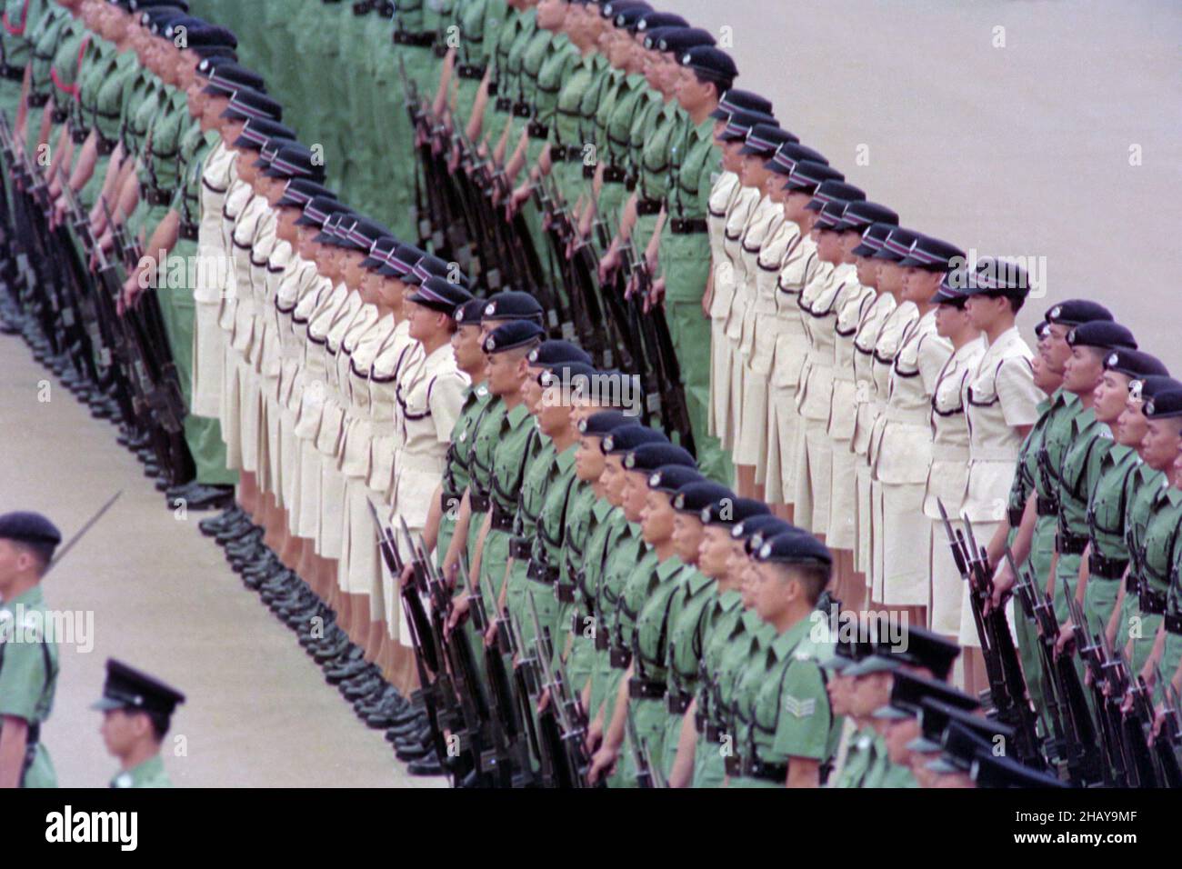 Royal Hong Kong Police 150th Anniversary Parade, at Police Training School, Aberdeen, Hong Kong Date: Summer 1994. Male and female police officers are lined up in “Review Order”.  Commissioner of the RHKP, Mr LI Kwan-ha, took the salute. Stock Photo