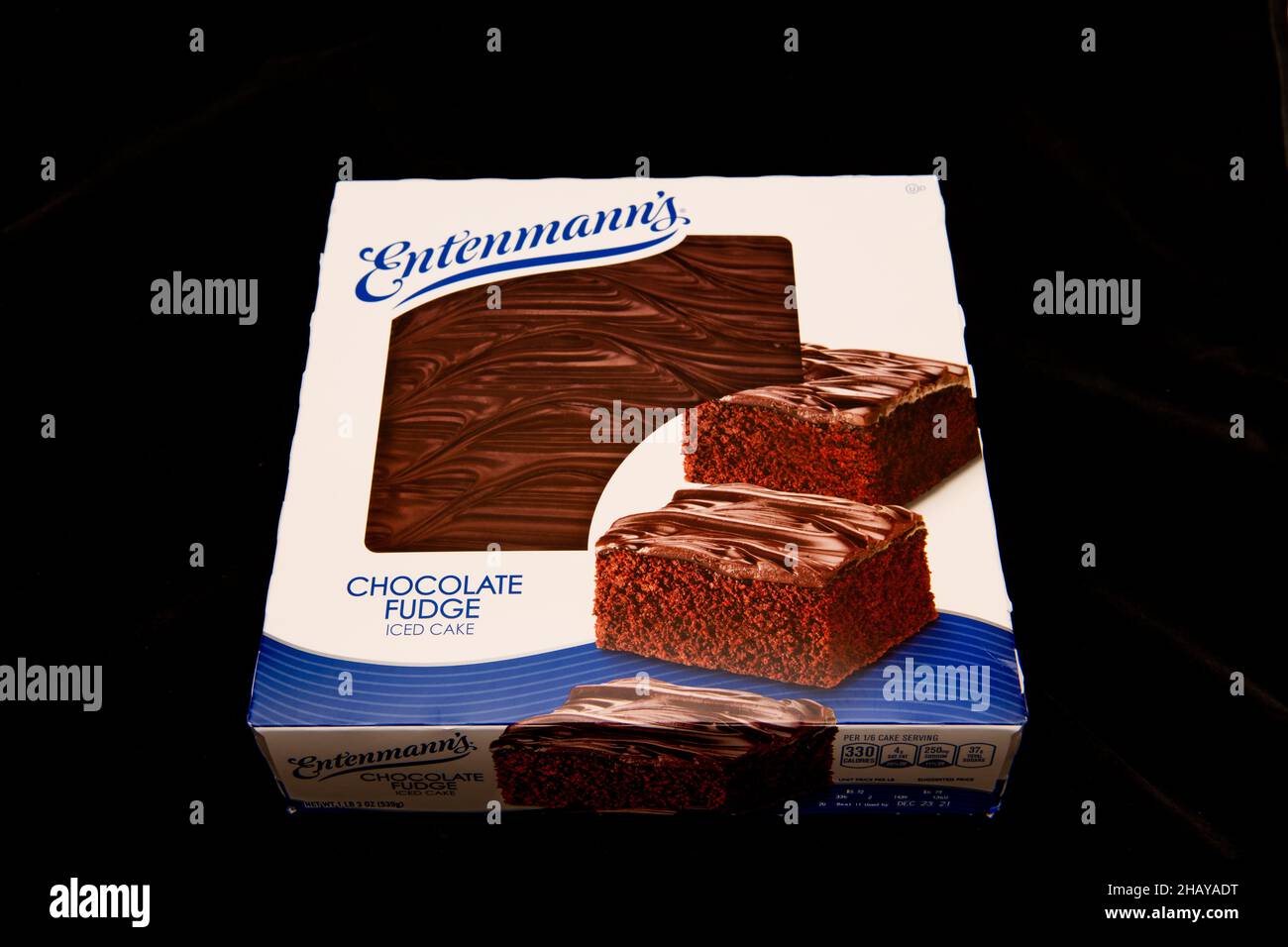 A box of Entenmann's Chocolate Fudge Iced cake isolated on black Stock