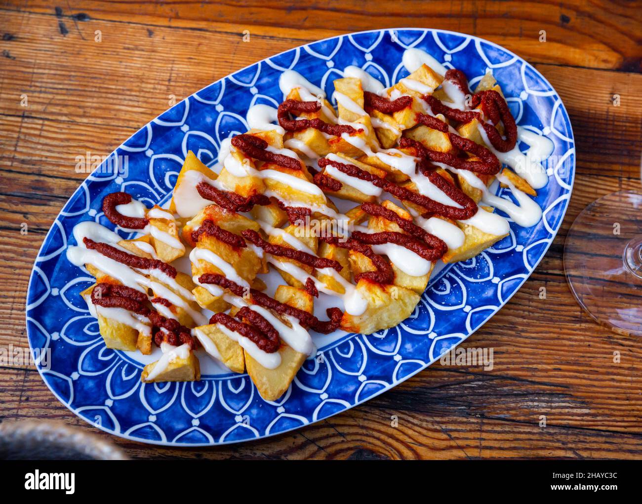Patatas Bravas with various sauces Stock Photo Alamy