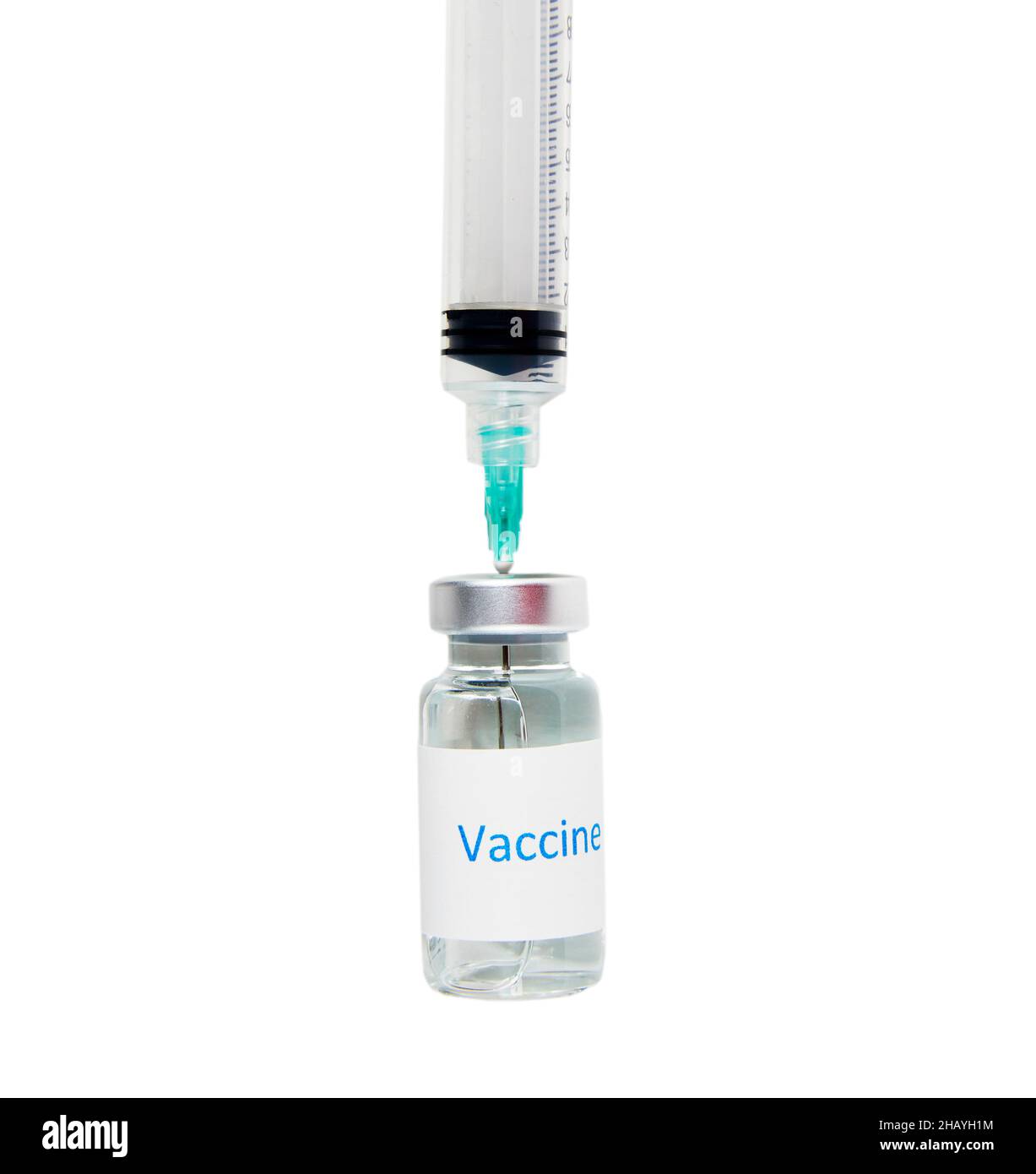 Vaccine bottle with a needle inserted into the bottle and syringe isolated on white Stock Photo