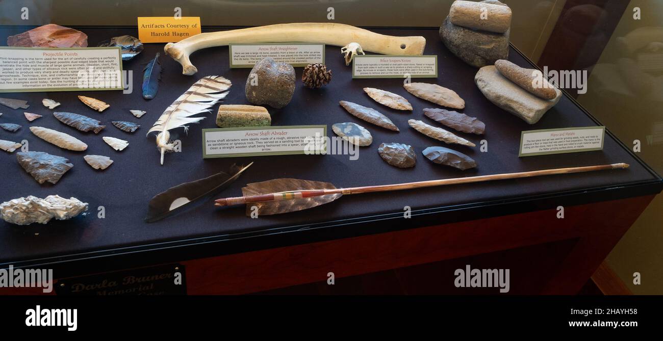 Display case at Pictograph Cave State Park museum near Billings, Montana, that shows ancient tools that indigenous people used, including arrowheads. Stock Photo