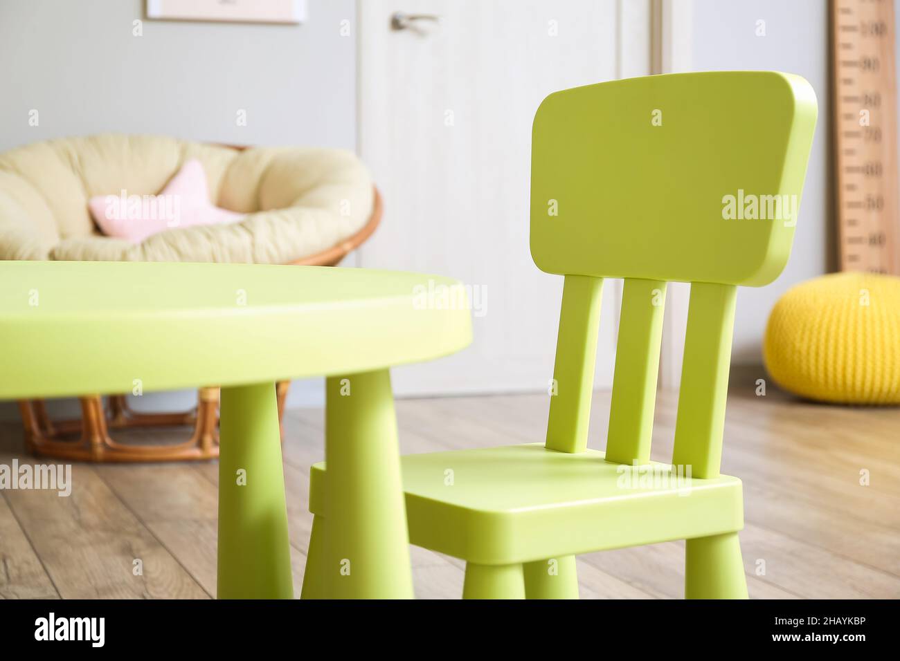 Interior of children's room with table and chair Stock Photo - Alamy