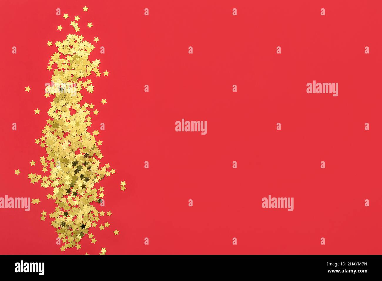 Golden confetti on red hi-res stock photography and images - Alamy