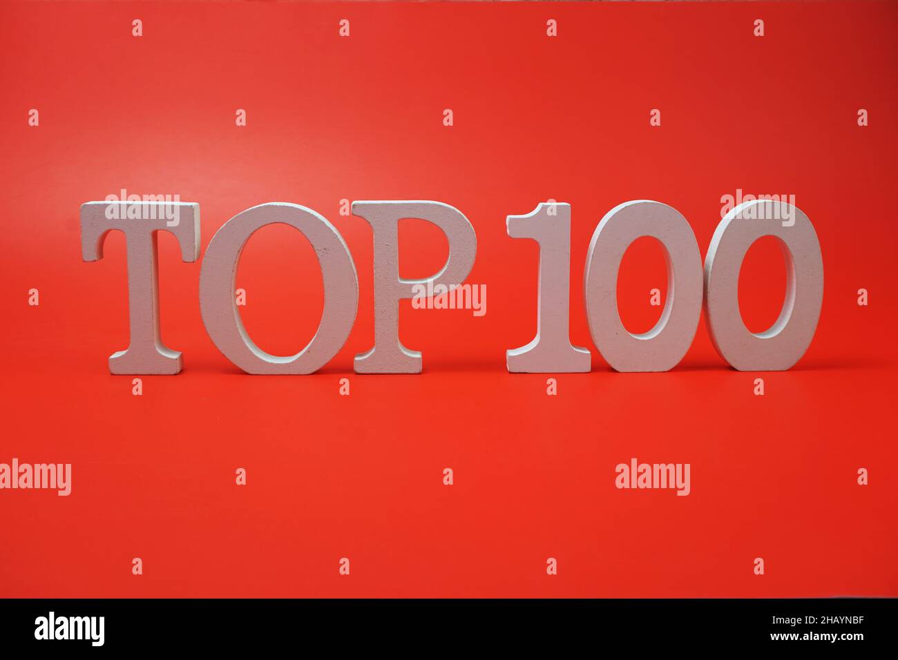 Top 100 word alphabet letters on red background Stock Photo