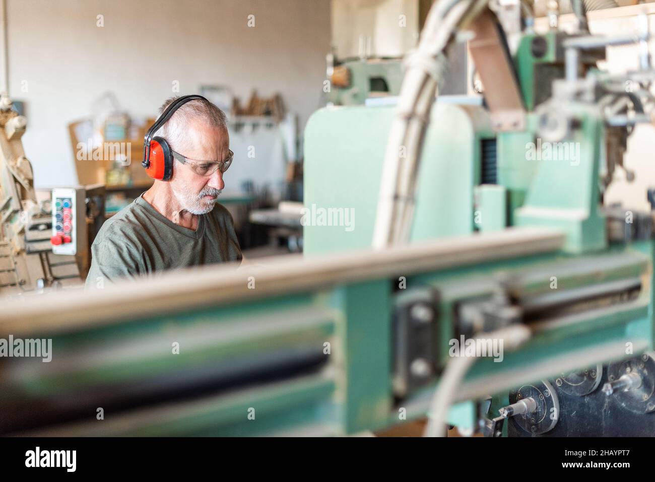 male employee working in an industrial factory Stock Photo