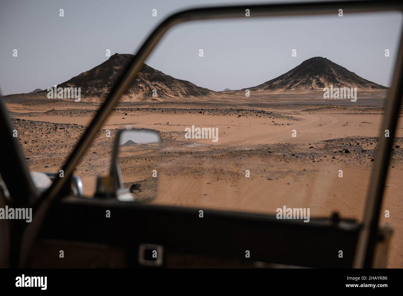 View of Black Desert through an open car window, Egypt Stock Photo