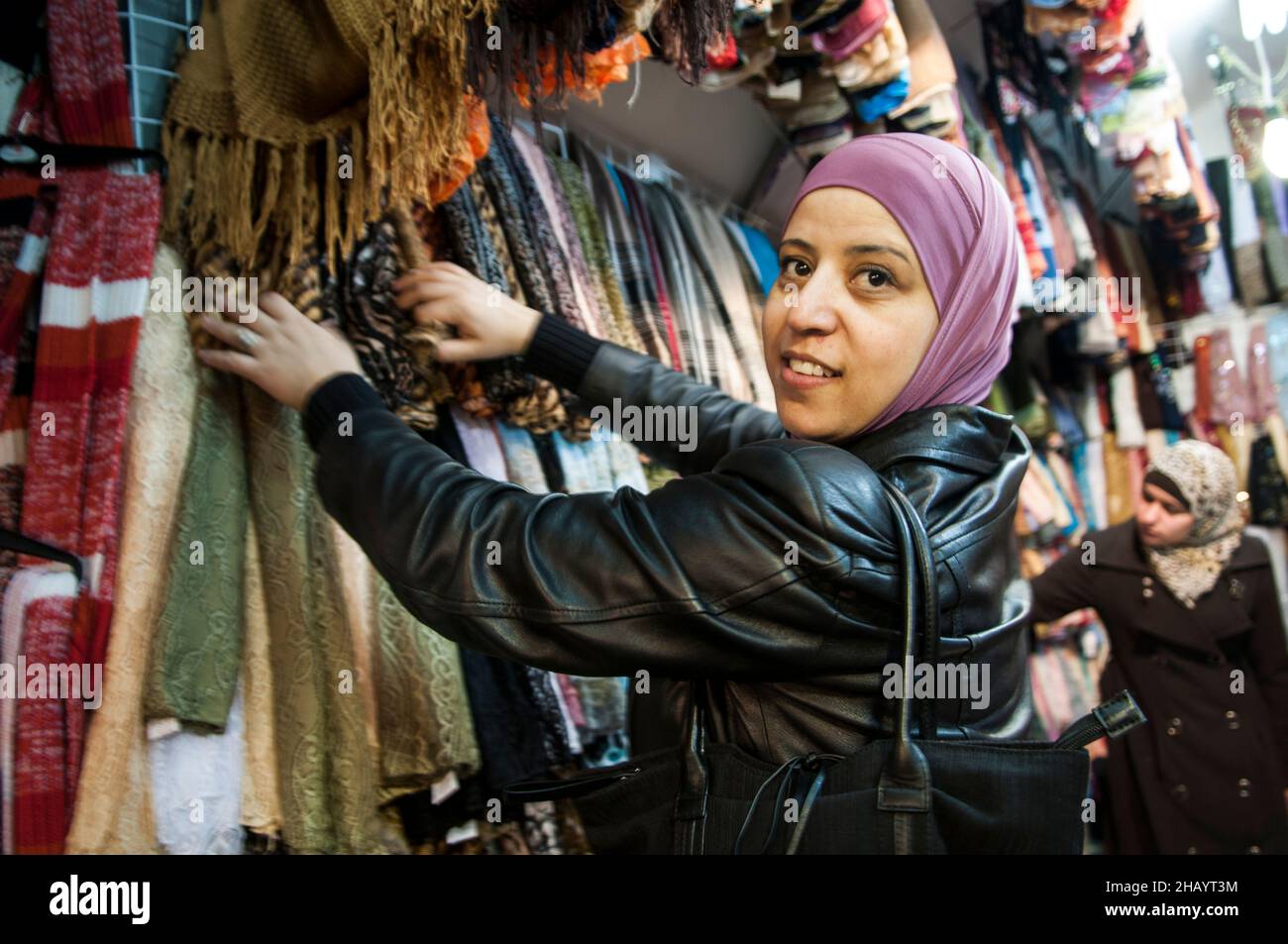 Palestinian women shopping in a small clothing store in the Muslim