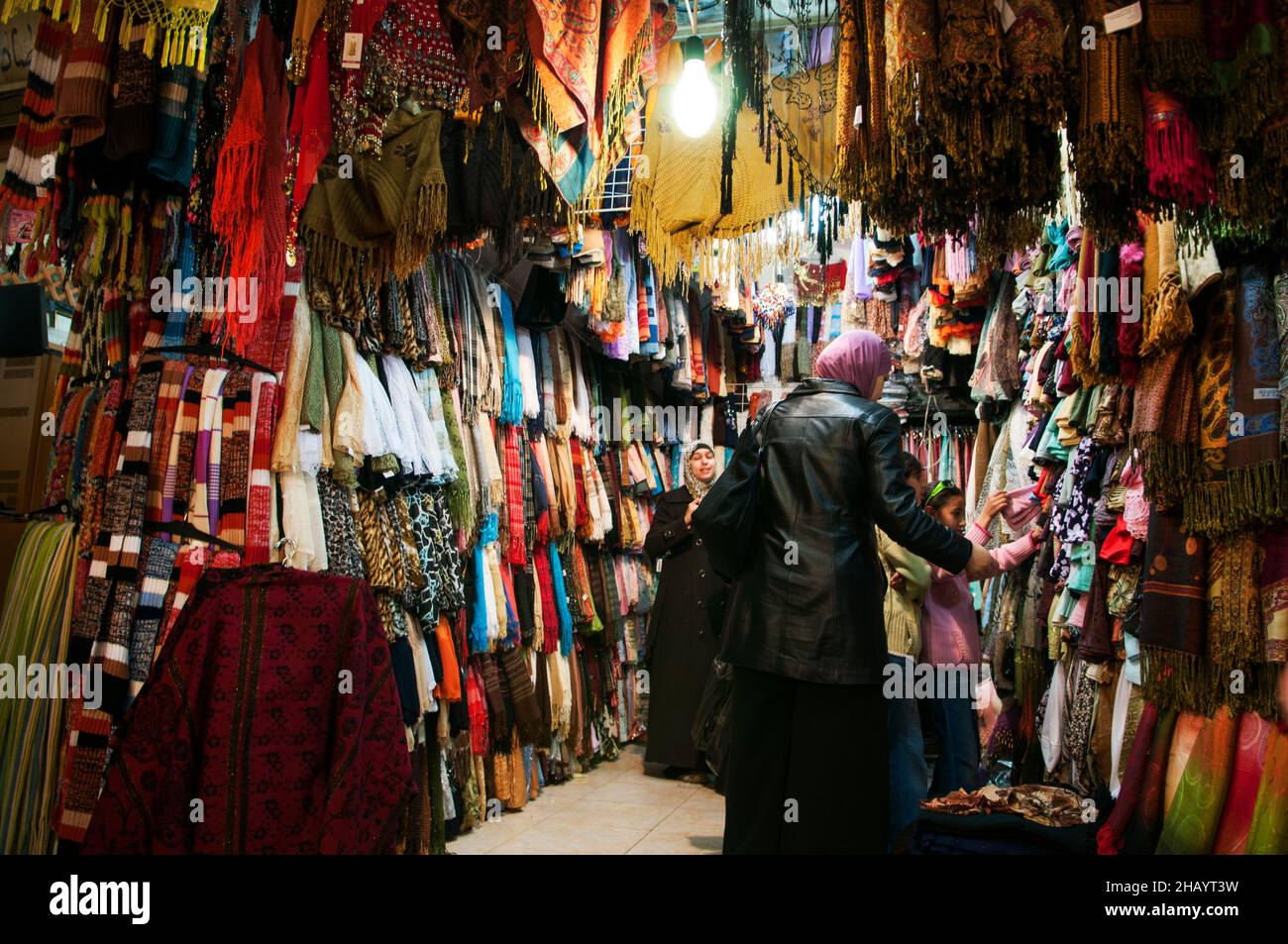 Palestinian women shopping in a small clothing store in the Muslim ...
