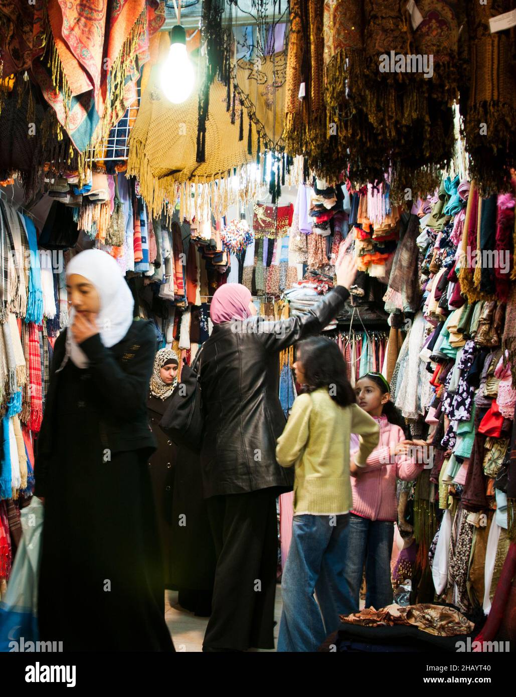 Palestinian women shopping in a small clothing store in the Muslim