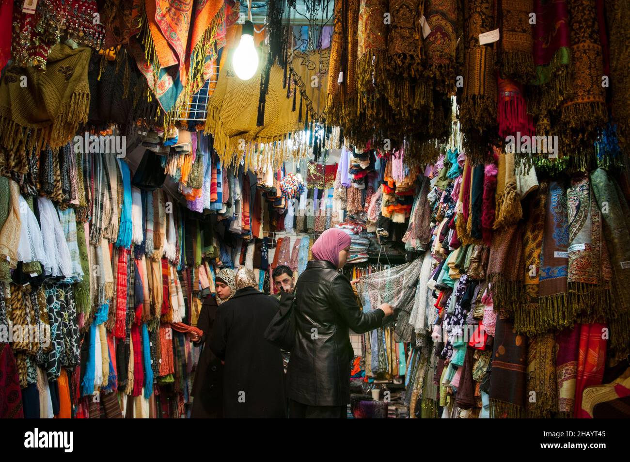 Palestinian women shopping in a small clothing store in the Muslim