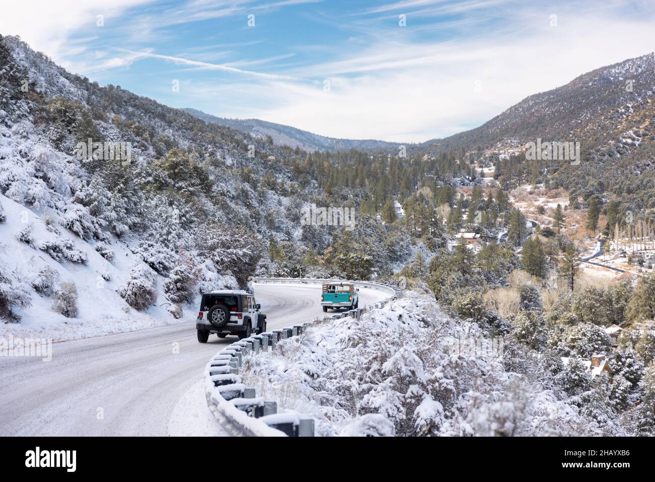 Cars travel out of town following a snow storm in Frazier Park