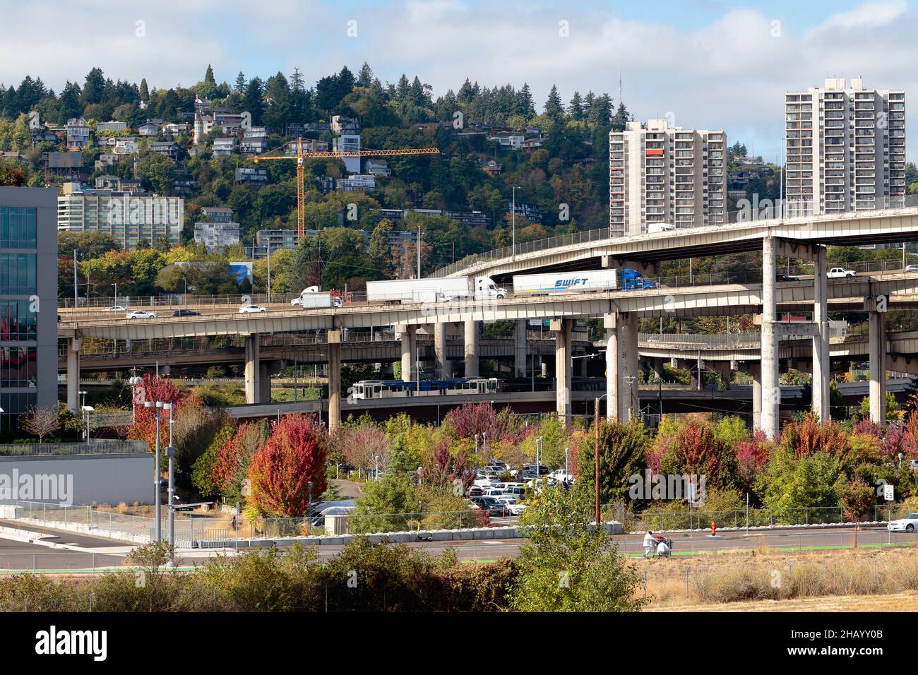 I-5 and 1-405 interchange in Portland, Oregon. Interstate 5 and interstate 405 highway interchange viaduct with Goose Hollow as backdrop. Stock Photo